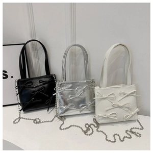 Three bow bucket bags in black silver and white with metal chain straps for women
