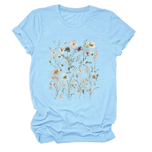 Close-up of floral print and butterfly design on light blue short sleeve t-shirt