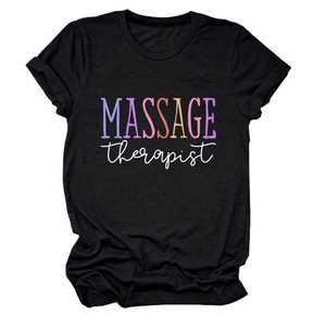 Close-up of 'MASSAGE therapist' colorful print on black cotton crewneck t-shirt fabric