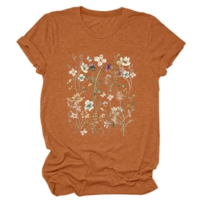 Close-up of elegant floral wildflower print on a caramel crew neck short sleeve T-shirt