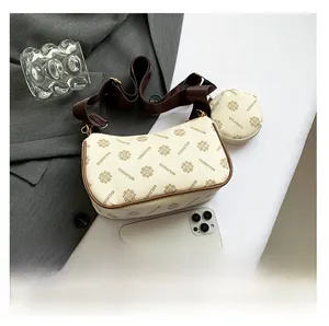 Detail of a beige letter-print small square bag with a wide strap and mini coin pouch