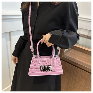 Macro view of purple crossbody bag featuring premium crocodile texture and ZMIEBO logo