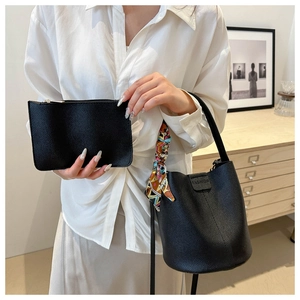 Chic black bucket bag set with litchi texture and silk scarf shown on model