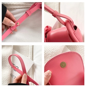 Detail view of pink kids crossbody bag showing adjustable metal buckle and stitching