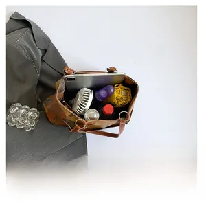 Macro view showing large capacity interior of the color-block tote bag for essentials