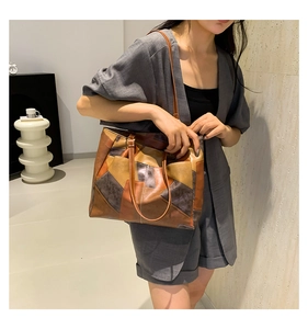 Close-up of retro color-block patchwork tote bag with high-quality leather texture