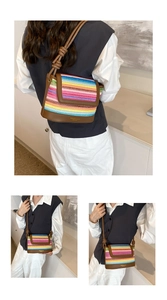 Macro view of colorful striped woven texture with leather trim and gold embossed logo