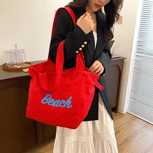 Red nylon tote bag with blue Beach print and large capacity for casual commute