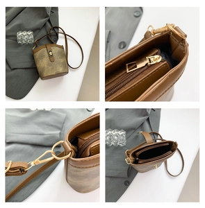 Detail view of retro brown bucket bag with contrast twist lock and gold-tone hardware