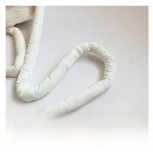 Detailed macro view of soft quilted white shoulder strap with reinforced stitching