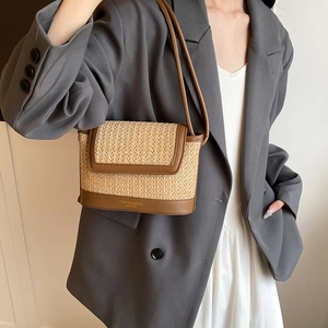 Chic rainbow woven straw underarm bag with brown leather straps and base for beach style