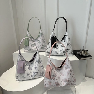 Floral butterfly print hobo tote bags in four pastel colors with matching card pouches