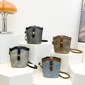 Maillard bucket shoulder bags in grey, khaki, and denim blue with metal lock closures