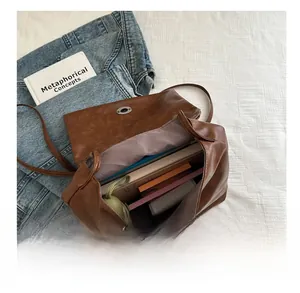 Detail showing spacious interior capacity of the vintage caramel brown tote bag