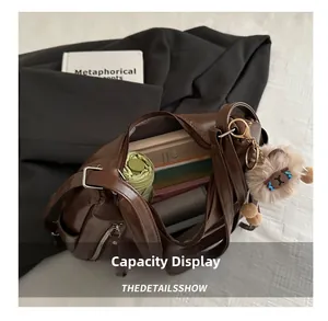 Top-down view of a spacious brown tote bag interior showing large storage capacity