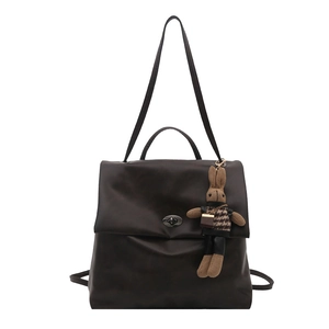 Dark brown oil wax leather vintage backpack with metal turn-lock and rabbit charm