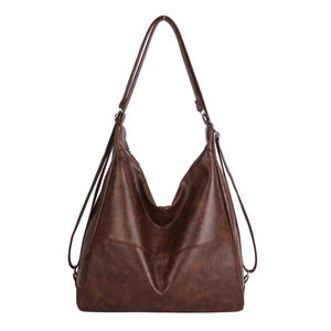 Vintage brown PU leather tote bag with V-cut design and adjustable strap on white background