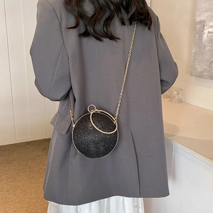 Chic black spherical evening bag with sequins, gold chain strap and crystal ring handle