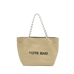 Khaki canvas tote bag with black TOTE BAG print and woven rope handles on white background
