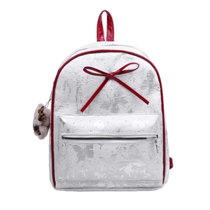 Polka dot jacquard backpack with red ribbon bow and leopard plush charm on white background