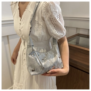Silver metallic butterfly hobo bag with pleated texture and stylish shoulder strap