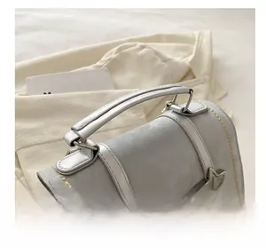 Detail of star embroidery and gold wavy stitching on a grey minimalist backpack