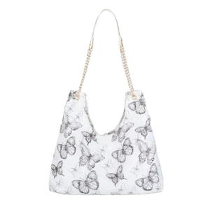 Canvas hobo bag with black butterfly print and gold chain strap on white background