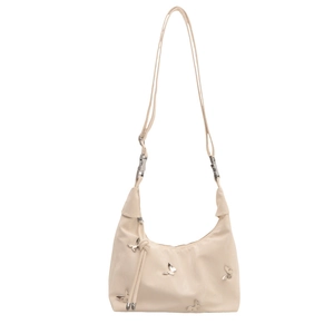 Cream shoulder bag with silver butterfly studs and adjustable strap on white background