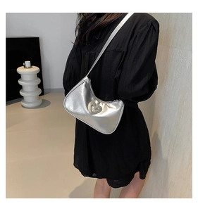 Chic silver shoulder bag with large heart rhinestone buckle detail on the front