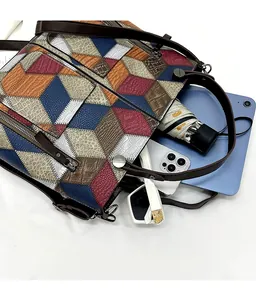 Detail view of large tote bag interior showing spacious multi-texture patchwork capacity