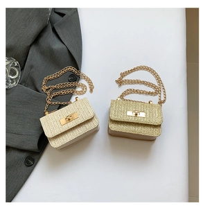 Close-up of woven straw texture and gold chain straps on beige and khaki mini bags
