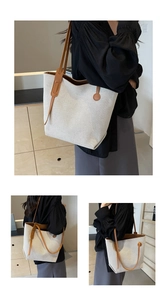 Detailansicht der Canvas-Tasche mit verstärkten braunen Ledergriffen und festem Stoffgewebe