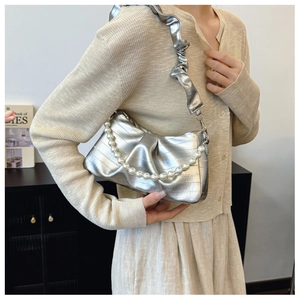 Silver metallic pleated hobo bag with pearl chain and ruched strap on shoulder