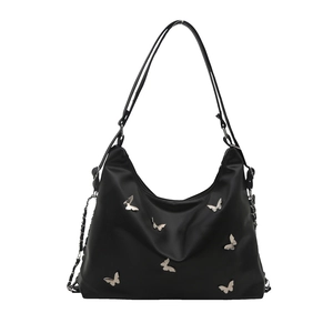 Women's black butterfly tote bag made of satin nylon with silver metal butterfly charms