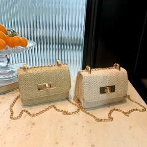Mini straw woven crossbody bag with gold lock and chain strap in cream and khaki