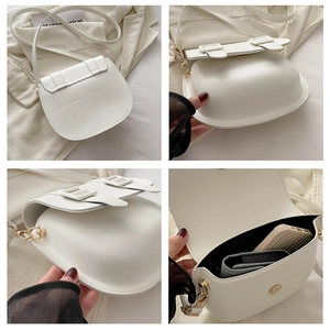 Detailed views of white saddle bag showing gold hardware and internal storage capacity