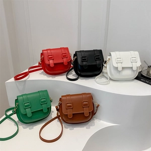 Retro minimalist saddle bags for women in five colors displayed on tiered white steps