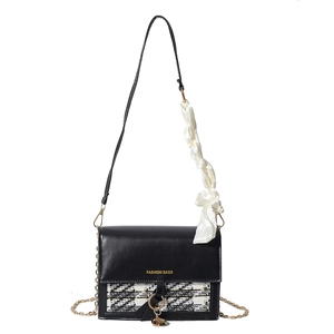 Fashionable black leather and tweed crossbody bag with elegant silk scarf handle