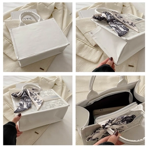 Detail view of white tote bag with floral silk scarf and elegant BAG lettering