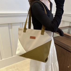 Large color-block canvas tote bag for women featuring stylish green and beige geometric design