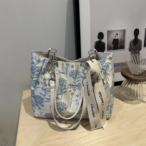 Large floral canvas tote bag with metal chain strap and blue flower pattern for women