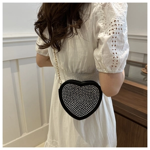 Elegant heart-shaped crossbody bag with silver studs and gold chain strap for women