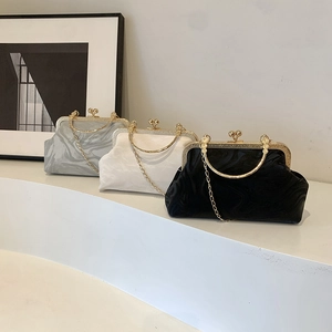Elegant Chinese style clutch bags with marble texture, gold metal frames, and chain straps