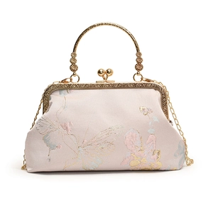 Elegant pale pink jacquard floral evening bag with golden round metal handle and chain