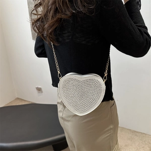 Chic heart-shaped crossbody bag with silver rhinestones and gold chain strap for women