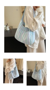 Detail of multi-color striped tote bag showing the side pocket and canvas texture