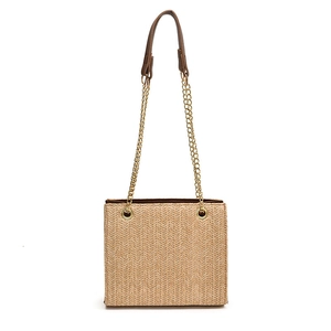 Woven tote bag with gold chain strap and beige herringbone pattern on white background