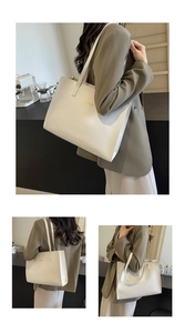 Macro detail of creamy white PU leather tote bag featuring gold lettering and smooth texture