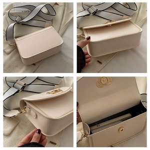 Detailed views of cream saddle bag with wide strap and gold hardware interior