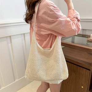 Chic woven beach hobo bag in creamy white with leather trim for 2024 summer fashion